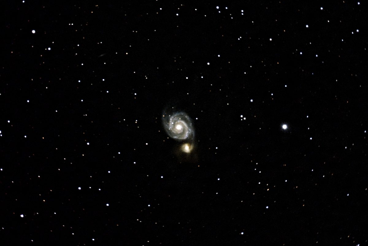 The Whirlpool Galaxy, a face-on spiral with a smaller companion galaxy.